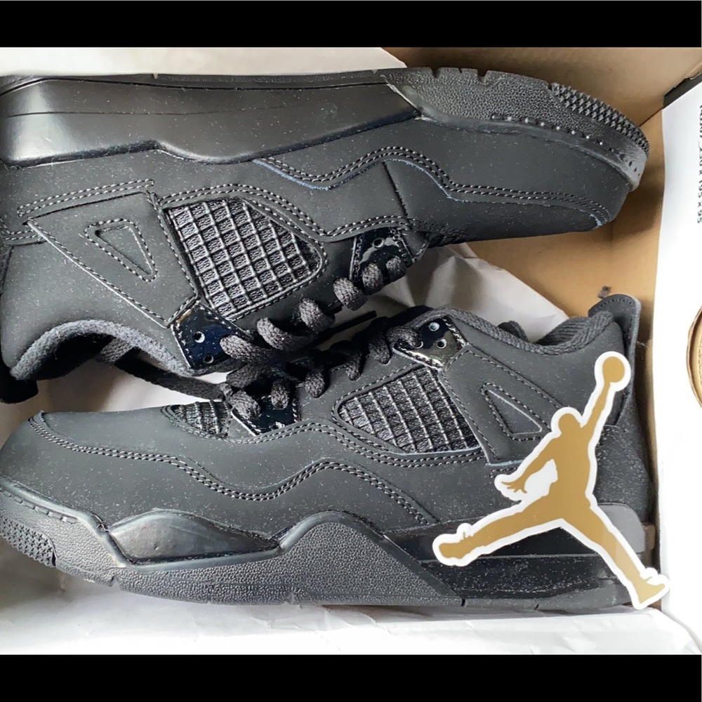 Black cat Jordan 4s